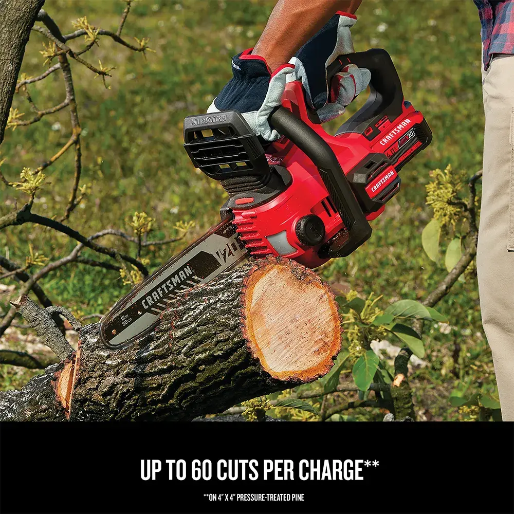 Close-up view of the CRAFTSMAN Cordless 12-Inch Compact Chainsaw cutting a tree trunk