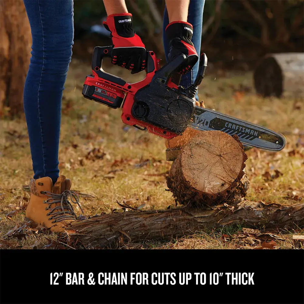 Close-up view of the CRAFTSMAN Cordless 12-Inch Compact Chainsaw cutting a log