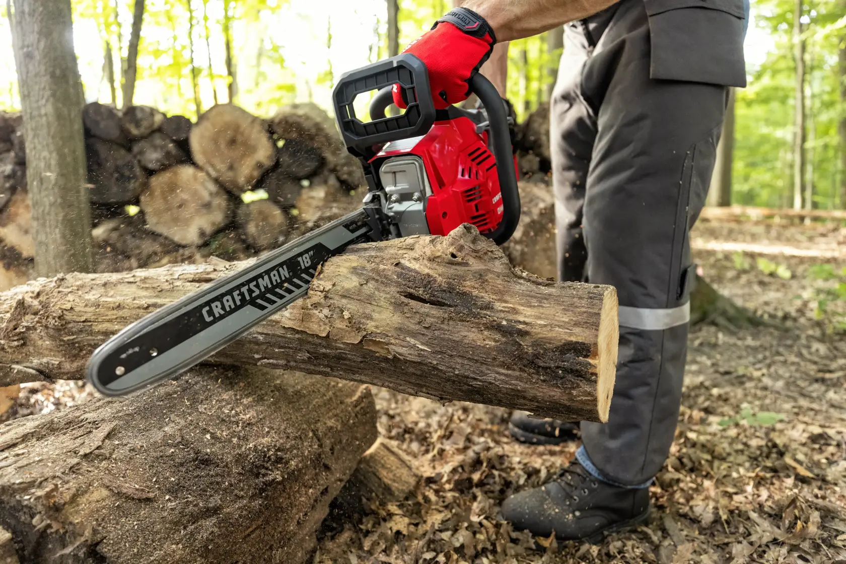  CRAFTSMAN  S180 18 in. Gas Chainsaw being used to cut a log