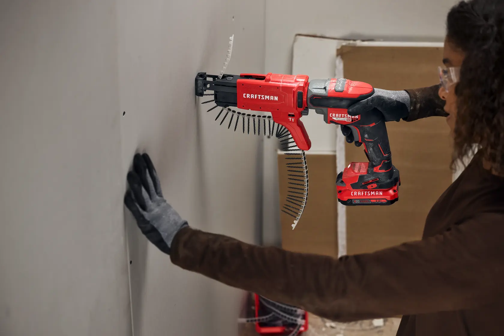 Craftsman V20 Brushless RP Drywall Screwgun fastening into drywall using collator attachment