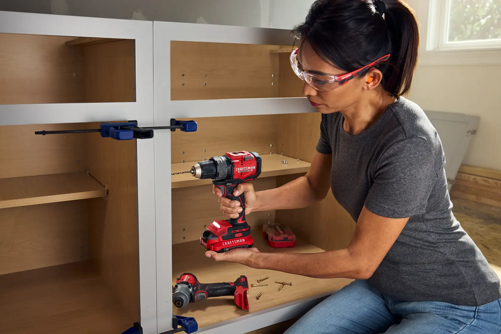 CRAFTSMAN V20* RP Drill drilling pilot hole in cabinet