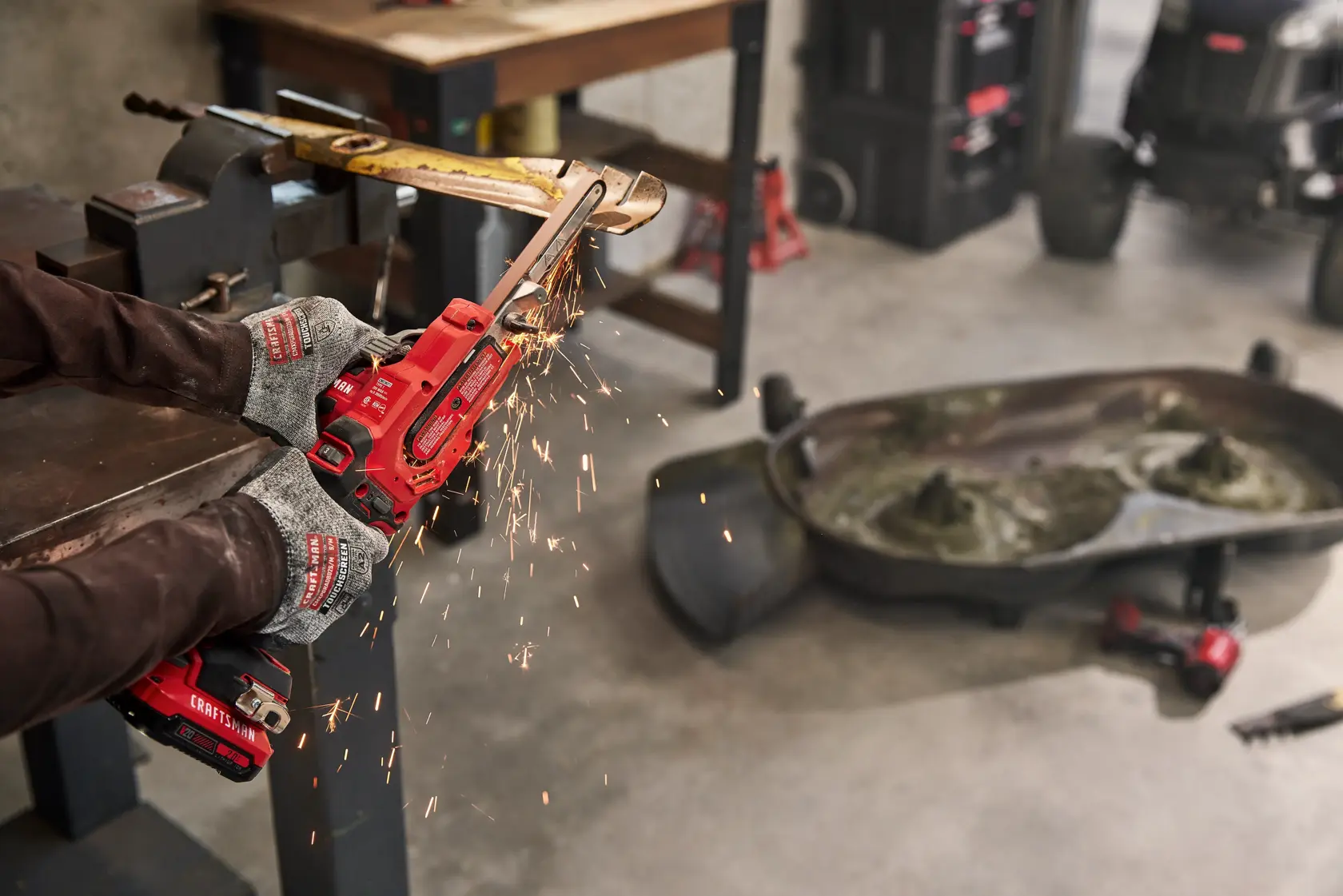 Craftsman V20 Powerfile sharpening a lawn mower blade