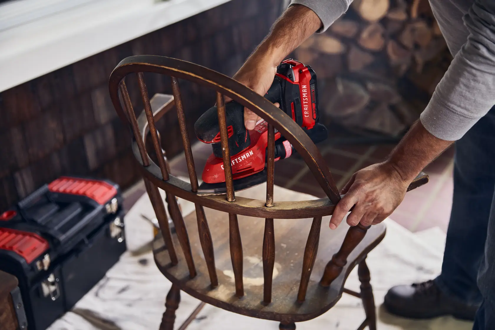 20 volt cordless detail sander being used.