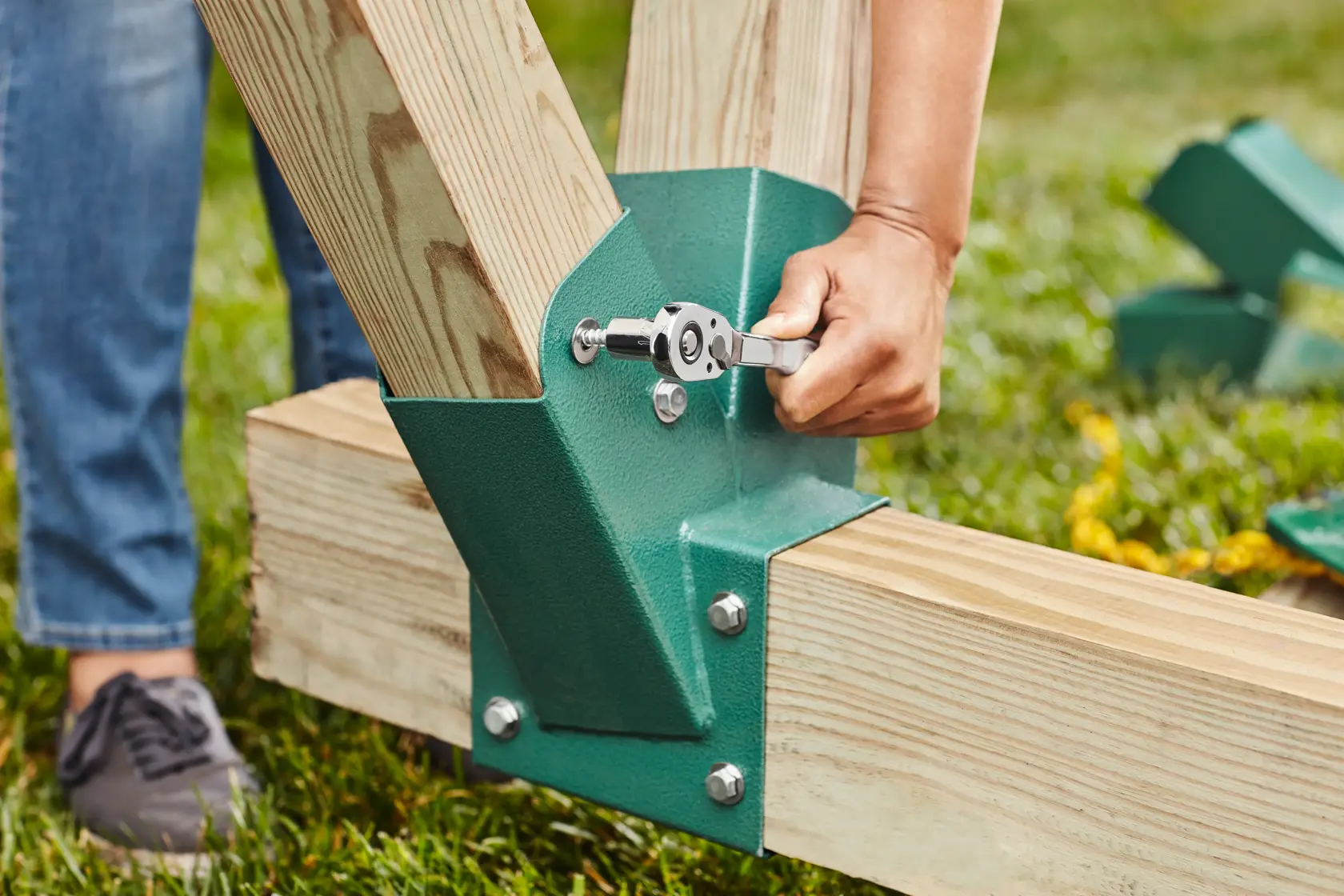 Close-up of CRAFTSMAN 3/8" drive ratchet working on kids play set